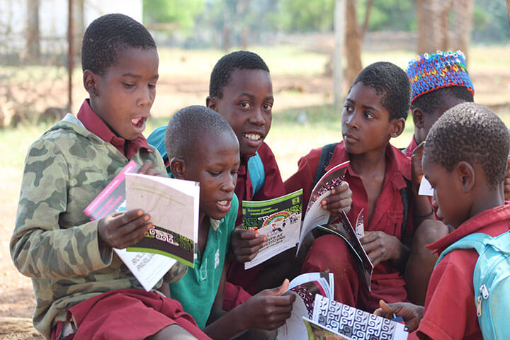 Children reading and discussing together